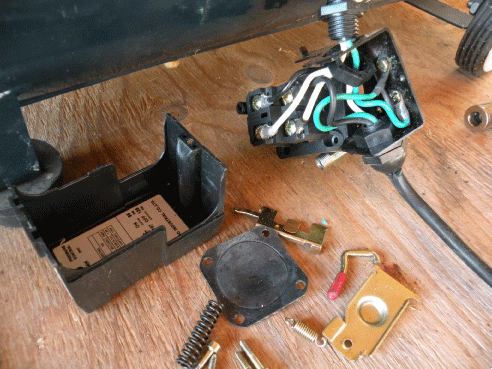Replacing a compressor pressure switch - pressure switch disassembled